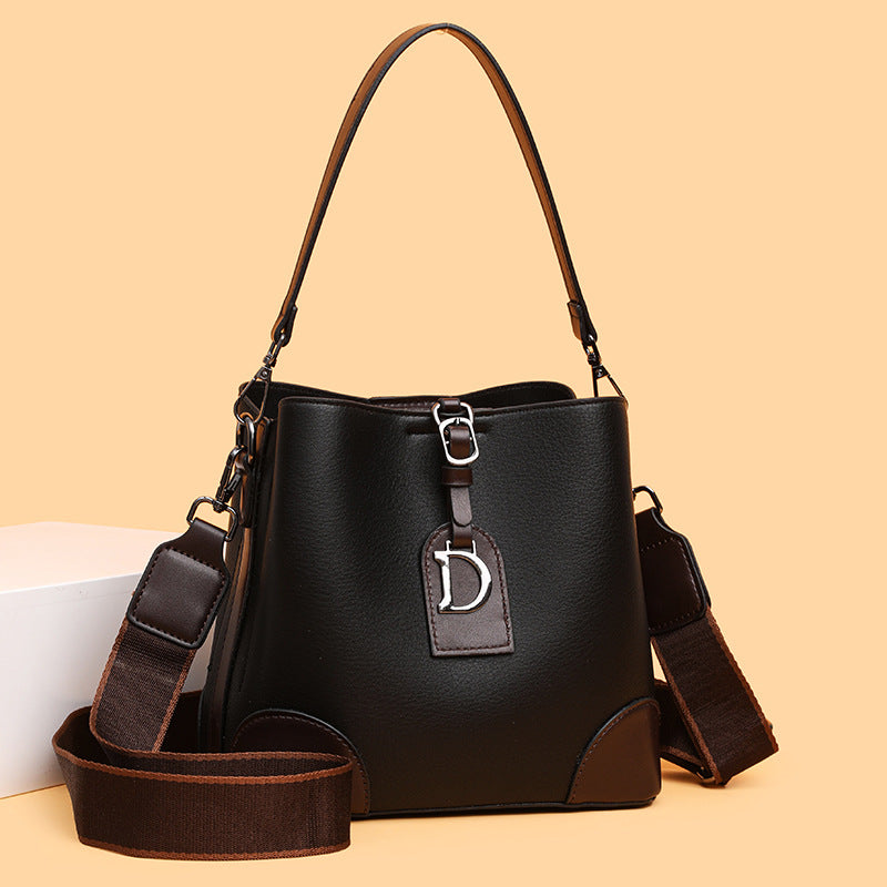 Stylish women's contrast color bucket bag with single shoulder strap and three-dimensional pockets in black and brown PU material
